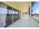 Expansive screened patio with views of the serene lake, offering an ideal space for relaxation and entertainment at 5492 Compass Pt, Oxford, FL 34484