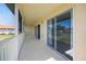 Long, screened patio has tile floor and large sliding glass doors at 5492 Compass Pt, Oxford, FL 34484