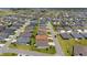 Aerial view of neighborhood including single story homes, and a golf course at 560 Caputo Ct, The Villages, FL 32163