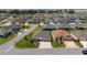 Extensive neighborhood featuring single-story homes with mature landscaping and neighborhood streets at 560 Caputo Ct, The Villages, FL 32163