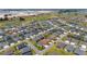 Neighborhood aerial showcasing single Gathering homes, landscaping and lush grass at 560 Caputo Ct, The Villages, FL 32163
