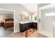 Bright bathroom featuring double sinks, tile flooring, and a convenient walk-in shower at 560 Caputo Ct, The Villages, FL 32163