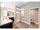 Bathroom boasts double sinks, tile flooring, and a walk-in shower with glass enclosure at 560 Caputo Ct, The Villages, FL 32163