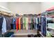Walk-in closet with ample storage featuring rods, shelves, and organized space at 560 Caputo Ct, The Villages, FL 32163