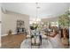 Inviting dining area with a glass-top table, providing ample space for entertaining at 560 Caputo Ct, The Villages, FL 32163