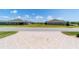 View from the driveway, showcasing the front facades of homes in the community at 560 Caputo Ct, The Villages, FL 32163