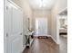 Stylish foyer featuring wood-look tile flooring and an open view of the interior at 560 Caputo Ct, The Villages, FL 32163
