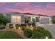 Charming single-story home with landscaped front yard and a two-car garage at 560 Caputo Ct, The Villages, FL 32163