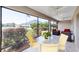Relaxing screened lanai with outdoor dining and lounge areas, offering privacy at 560 Caputo Ct, The Villages, FL 32163