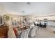 Spacious living area with kitchen, dining, and sitting areas, promoting seamless entertaining at 560 Caputo Ct, The Villages, FL 32163