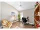 Home office with vaulted ceiling, fan, and wood-look tile at 560 Caputo Ct, The Villages, FL 32163