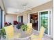Enjoy outdoor living on this covered patio with comfortable seating and seamless indoor-outdoor flow at 560 Caputo Ct, The Villages, FL 32163