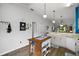 Kitchen boasts an island, ample cabinet space, wood floors, and a functional layout at 579 Juniper Way, Tavares, FL 32778
