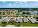 Aerial view showcasing the neighborhood's green spaces, ponds, and community layout at 5818 Greenbriar Loop, Leesburg, FL 34788