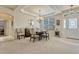 Elegant dining room boasts natural light and a tray ceiling above at 5818 Greenbriar Loop, Leesburg, FL 34788