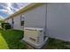 Exterior view of a home generator for backup power during outages at 5818 Greenbriar Loop, Leesburg, FL 34788