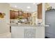Well-equipped kitchen with stainless steel appliances and granite countertops at 5818 Greenbriar Loop, Leesburg, FL 34788