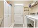 Well-organized laundry room with modern washer, dryer, and storage cabinets at 5818 Greenbriar Loop, Leesburg, FL 34788
