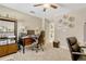 Spacious home office with modern desk, computer, and ample storage at 5818 Greenbriar Loop, Leesburg, FL 34788