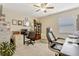 Home office featuring desk, computer, and filing cabinets for organization at 5818 Greenbriar Loop, Leesburg, FL 34788