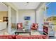 Inviting outdoor patio with a grill, comfortable seating and television at 5818 Greenbriar Loop, Leesburg, FL 34788