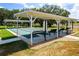 Shuffleboard courts with benches. Offers a relaxing outdoor recreational area and encourages community engagement at 5818 Greenbriar Loop, Leesburg, FL 34788