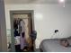 Bedroom features a spacious closet for ample storage, alongside essential furnishings at 604 N Old Wire Rd, Wildwood, FL 34785
