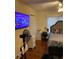 Cozy bedroom features a bed, desk, and TV for a relaxing and functional space at 604 N Old Wire Rd, Wildwood, FL 34785
