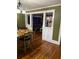 Dining room with hardwood floors and open floor plan connecting to the kitchen and living room at 604 N Old Wire Rd, Wildwood, FL 34785