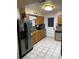 Bright kitchen featuring stainless steel appliances, granite countertops, and ample cabinet space at 604 N Old Wire Rd, Wildwood, FL 34785