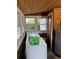 Functional laundry room with washer, dryer, and natural light, ideal for convenient chores at 604 N Old Wire Rd, Wildwood, FL 34785