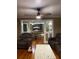 Inviting living room featuring hardwood floors, a ceiling fan, and comfortable furnishings at 604 N Old Wire Rd, Wildwood, FL 34785
