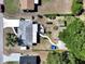 Overhead view showcasing the home, garden, shed, and landscaping at 616 Third Ave, Lady Lake, FL 32159