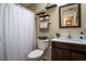 Neat bathroom featuring a vanity and a shower with a white curtain at 616 Third Ave, Lady Lake, FL 32159