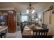Open-concept dining area flowing into the living room, showcasing natural light at 616 Third Ave, Lady Lake, FL 32159