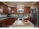 Well-equipped kitchen with stainless steel appliances and island, offers ample counter space at 616 Third Ave, Lady Lake, FL 32159