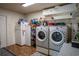 Laundry room with washer, dryer, and additional refrigerator at 616 Third Ave, Lady Lake, FL 32159