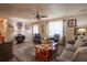 Comfortable living room with hardwood floors, neutral walls, and stylish lamps at 616 Third Ave, Lady Lake, FL 32159