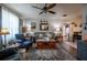 Spacious living room with hardwood floors, comfortable seating, and an inviting atmosphere at 616 Third Ave, Lady Lake, FL 32159
