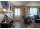 Cozy living room with hardwood floors, neutral walls, and elegant lamps at 616 Third Ave, Lady Lake, FL 32159