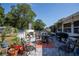 Outdoor kitchen and patio area with grill, brick flooring, and comfortable seating at 616 Third Ave, Lady Lake, FL 32159