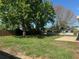 Expansive backyard featuring a patio and green lawn at 619 W Seminole Ave, Eustis, FL 32726