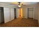 Bedroom featuring large closets and access to other rooms at 619 W Seminole Ave, Eustis, FL 32726