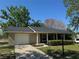 Charming single-story home with a well-maintained lawn and inviting curb appeal at 619 W Seminole Ave, Eustis, FL 32726