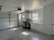 Spacious garage with white cabinets and ample storage space at 619 W Seminole Ave, Eustis, FL 32726
