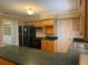 Functional kitchen with ample counter space, cabinetry, and black appliances at 619 W Seminole Ave, Eustis, FL 32726