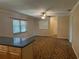 Bright living room with a ceiling fan, window, and access to other rooms at 619 W Seminole Ave, Eustis, FL 32726