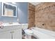 Bathroom with tile shower, neutral walls, white cabinets and drawers and tile flooring at 6808 Fern Cir, Leesburg, FL 34748