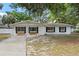 Charming one-story home with a well-manicured front yard and inviting entrance at 6808 Fern Cir, Leesburg, FL 34748