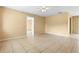 Spacious living room featuring tile floors, neutral walls, and ample natural light at 6808 Fern Cir, Leesburg, FL 34748